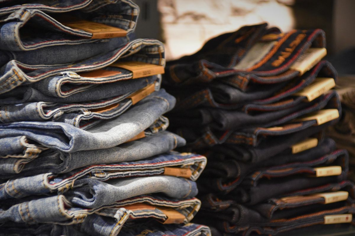 Stacked men's denim jeans